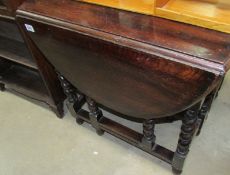 An oak barley twist gate leg table