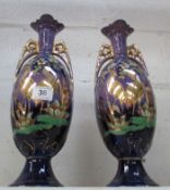 A pair of Oriental style bird decorated vases