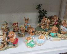 A Pendelfin stand and 15 Pendelfin rabbits