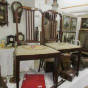 A pair of mahogany inlaid bedroom chairs with tapestry seats