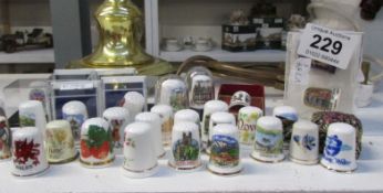 A quantity of china thimbles