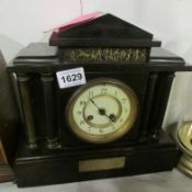 A marble Gothic style mantel clock with Welton plaque