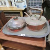 A copper tray, copper kettle and water bottle