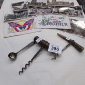 A silver mustard spoon, 2 corkscrews and postcards