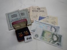 A mixed lot of ration books, Â£5 note, cufflinks etc