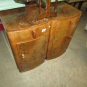 A pair of walnut veneered bedside cabinets