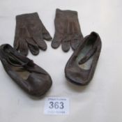 A pair of Victorian children's kid gloves and shoes