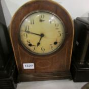 An inlaid mantel clock