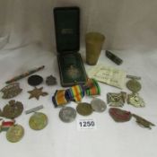 A mixed lot including WW1 & WW2 medals and badges, Victorian golden and diamond jubilee items etc.