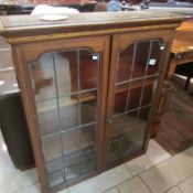 A mahogany inlaid bookcase top