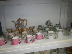 An Oriental coffee set and other cups and saucers