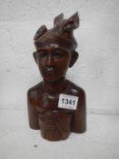 A carved wood 'Balinese' bust