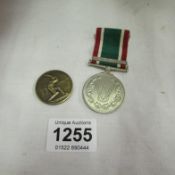 A WVS service medal and an RAF cricket award