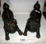 A pair of bronze Dogs of Foo