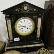 A Palladian style black marble mantel clock