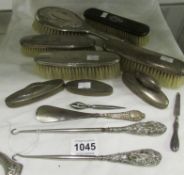 14 pieces of silver including silver backed brushes etc