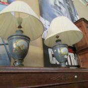 A pair of urn shaped table lamps