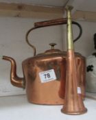 An oval copper kettle and a horn
