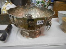 A silver plated punch bowl and other plated items