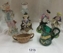 A pair of figures, 2 other figures, a Wade dish and a green glass jug