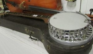 A Remo Weather King cased banjo