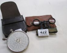 La Mignonne foldable binoculars and a Fowler vest pocket calculator