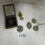 A Lincoln Football league 1902/03 silver fob, 4 other silver fobs and a gilt medallion