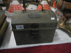 A vintage domed tin box