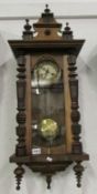 A mahogany wall clock.