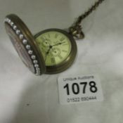 An ornate pocket watch