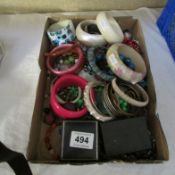 A mixed lot of costume jewellery including bangles etc