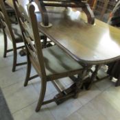 An oak table and 4 chairs