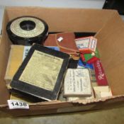 A box of photographic plates and other accessories