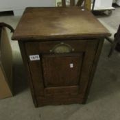 An oak coal cabinet