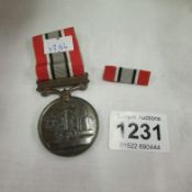 A British fire services association medal with bar