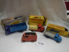 A Dinky 911 Guy 4 ton lorry, 410 Bedford tipper, 414 rear tipping wagon and a Royal Mail van