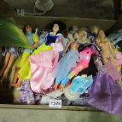 A box of vintage Cindy and Barbie dolls
