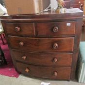 A 2 over 3 mahogany bow front chest of drawers