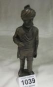 A bronze figure of a Turkish man in uniform