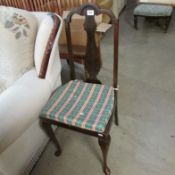 A mahogany dining chair