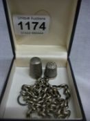 2 silver thimbles and a silver chain
