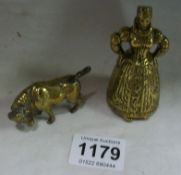 A rare brass lady bell with legs and a brass bull (no horns)