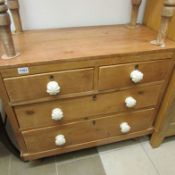 A 2 over 2 pine chest of drawers