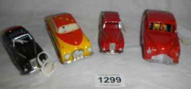 3 tin plate cars and a plastic taxi