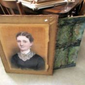 A pastel portrait of a lady and a print of a garden