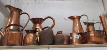 A large quantity of copperware including jugs, kettles etc