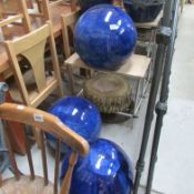 3 large blue pottery balls and a tree effect base