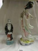 An Oriental figure of a man and a figure of a Geisha girl