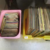 A box of LP records and a box of 45rpm records