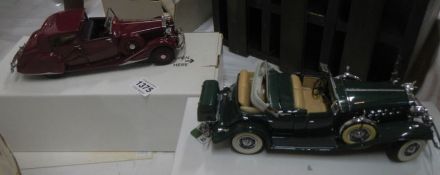 A model 1938 Rolls Royce Phantom and a 1932 Cadillac